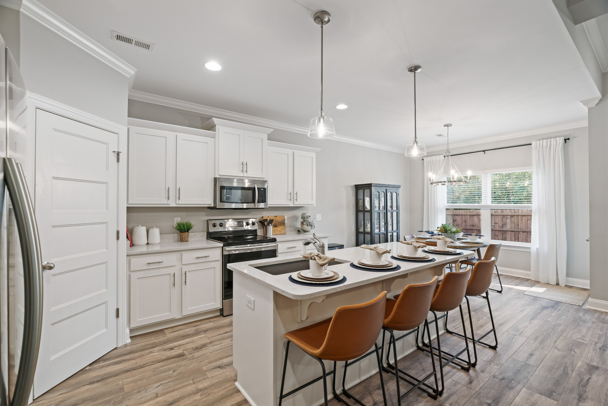 623 Gallant Way Murfreesboro, TN 37129 - Photo 14 of 48 a kitchen with a table chairs stove and microwave