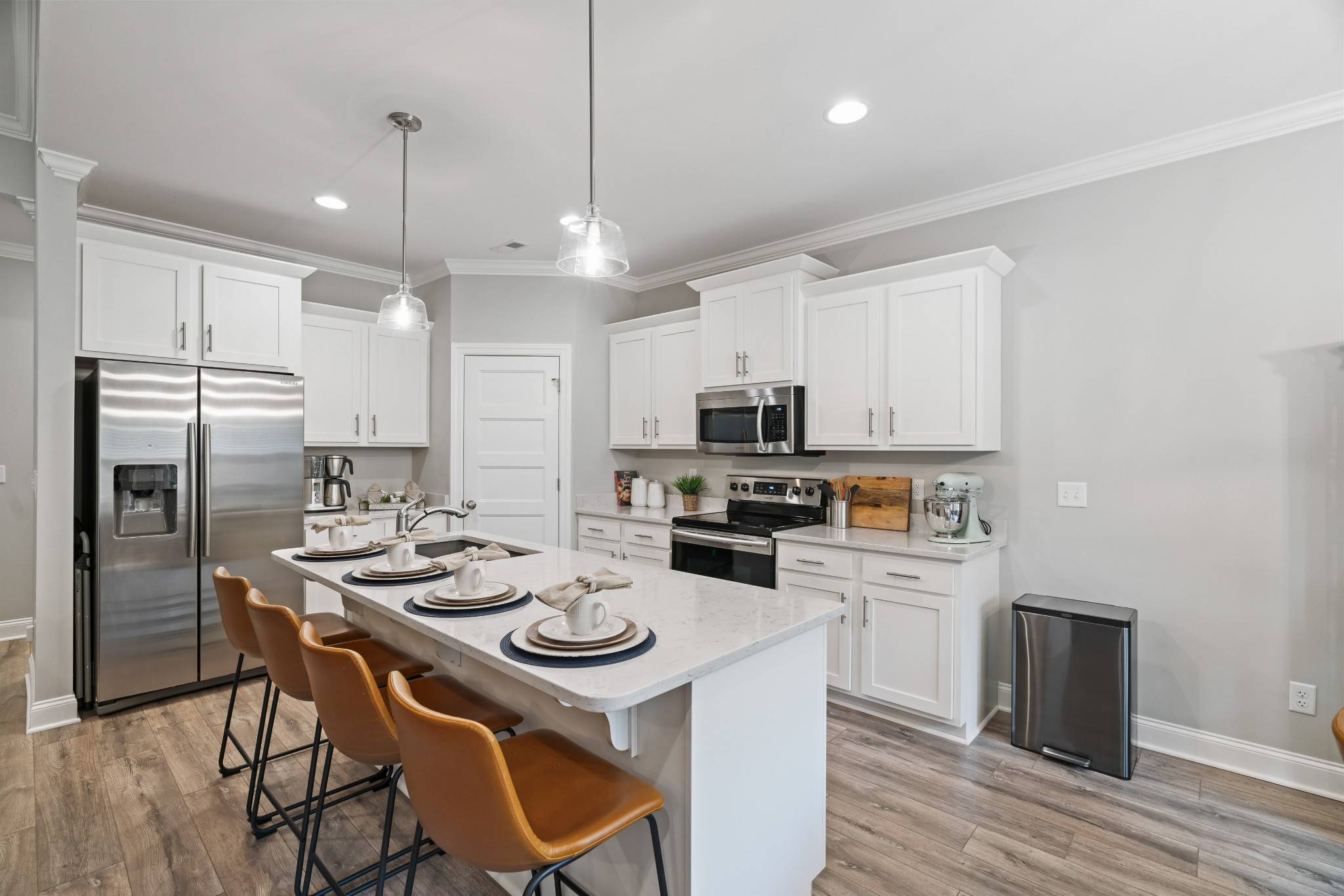 623 Gallant Way Murfreesboro, TN 37129 - Photo 19 of 48 a kitchen with stainless steel appliances kitchen island granite countertop a dining table chairs refrigerator and microwave