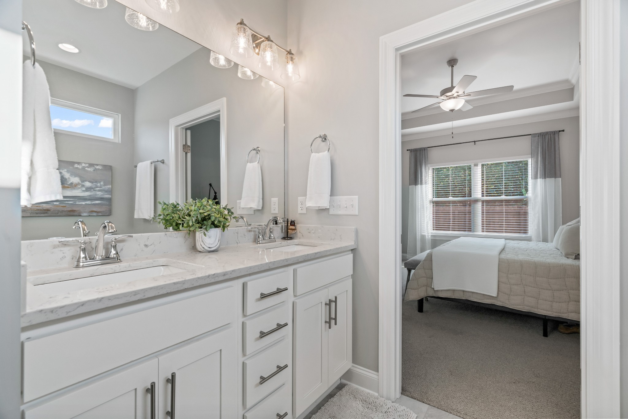 623 Gallant Way Murfreesboro, TN 37129 - Photo 30 of 48 a en suite bathroom with a double vanity sink a large mirror and a bathtub