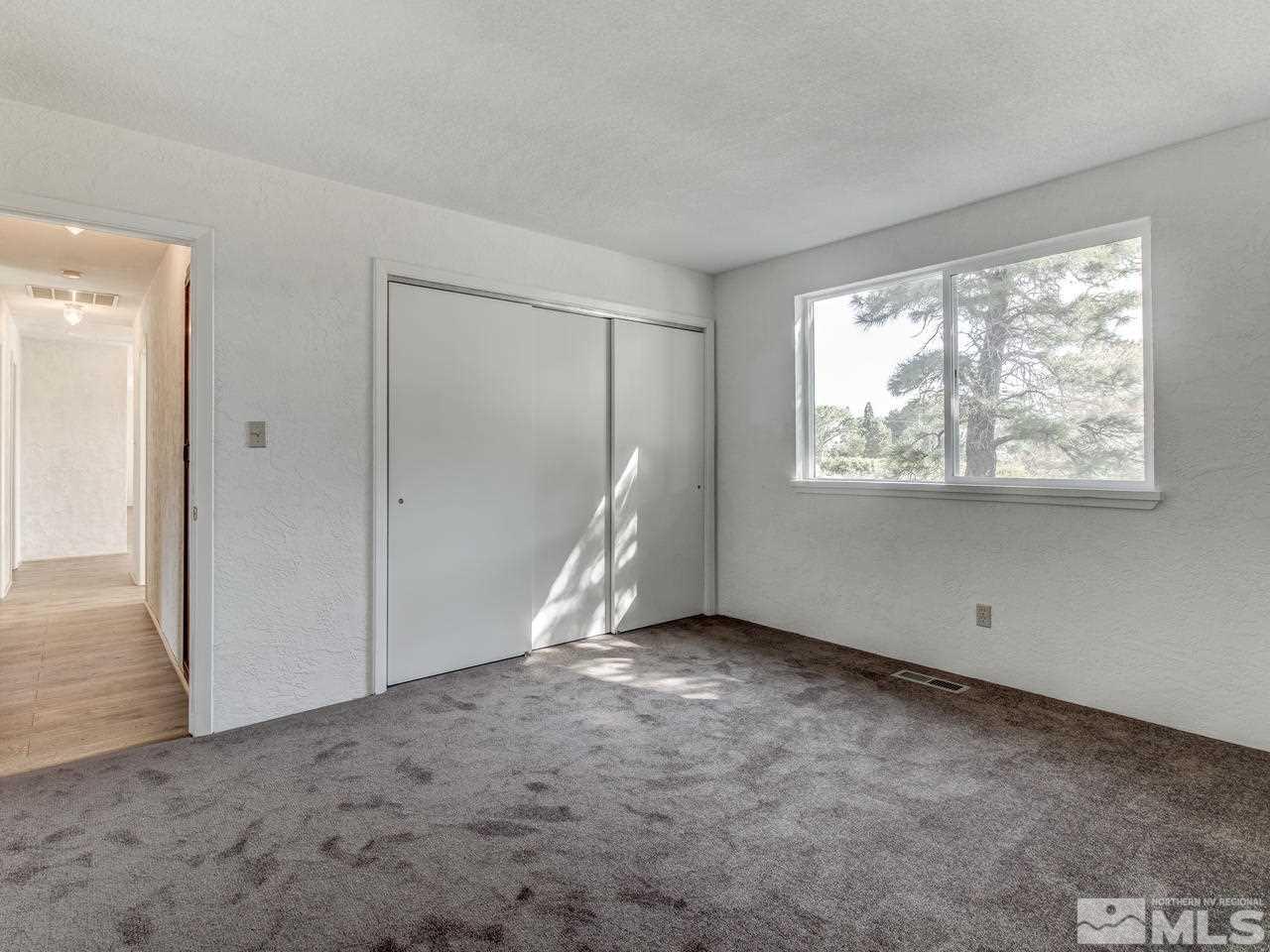 7465 Franktown Road Carson City, NV 89704 - Photo 16 of 25 an empty room with windows