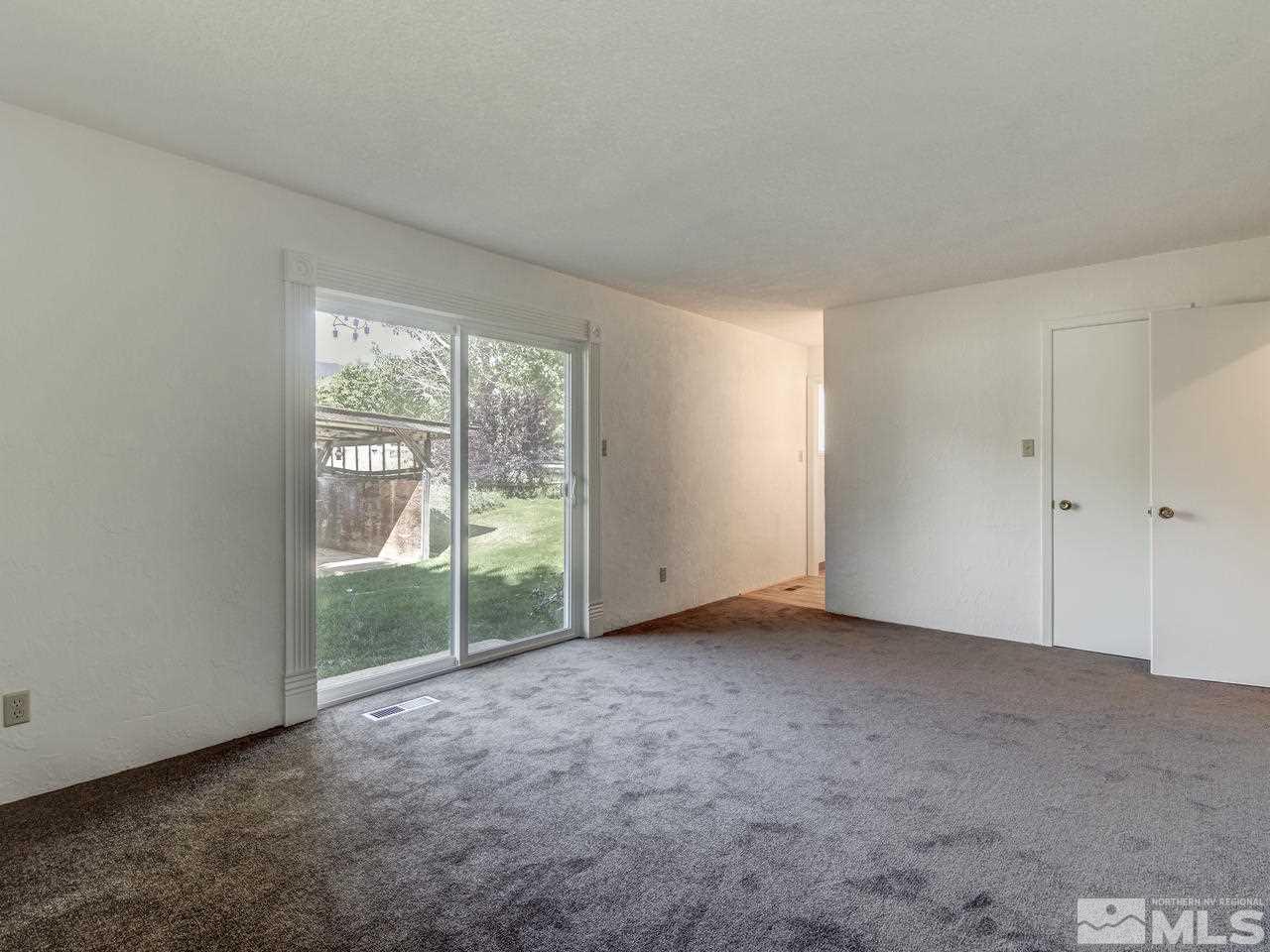 7465 Franktown Road Carson City, NV 89704 - Photo 19 of 25 a view of an empty room with a window
