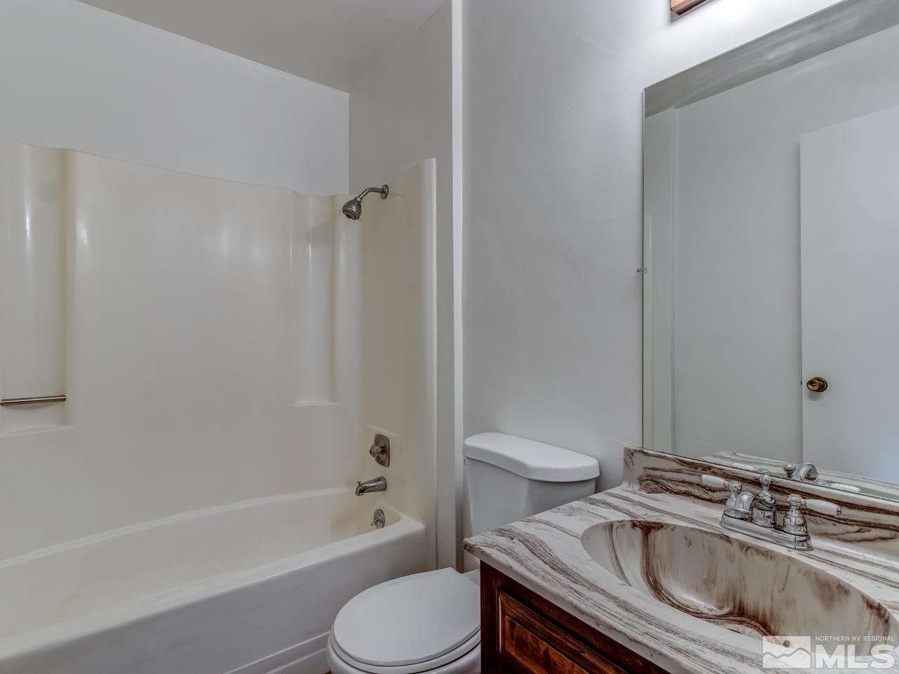 7465 Franktown Road Carson City, NV 89704 - Photo 21 of 25 a bathroom with a sink toilet and bathtub