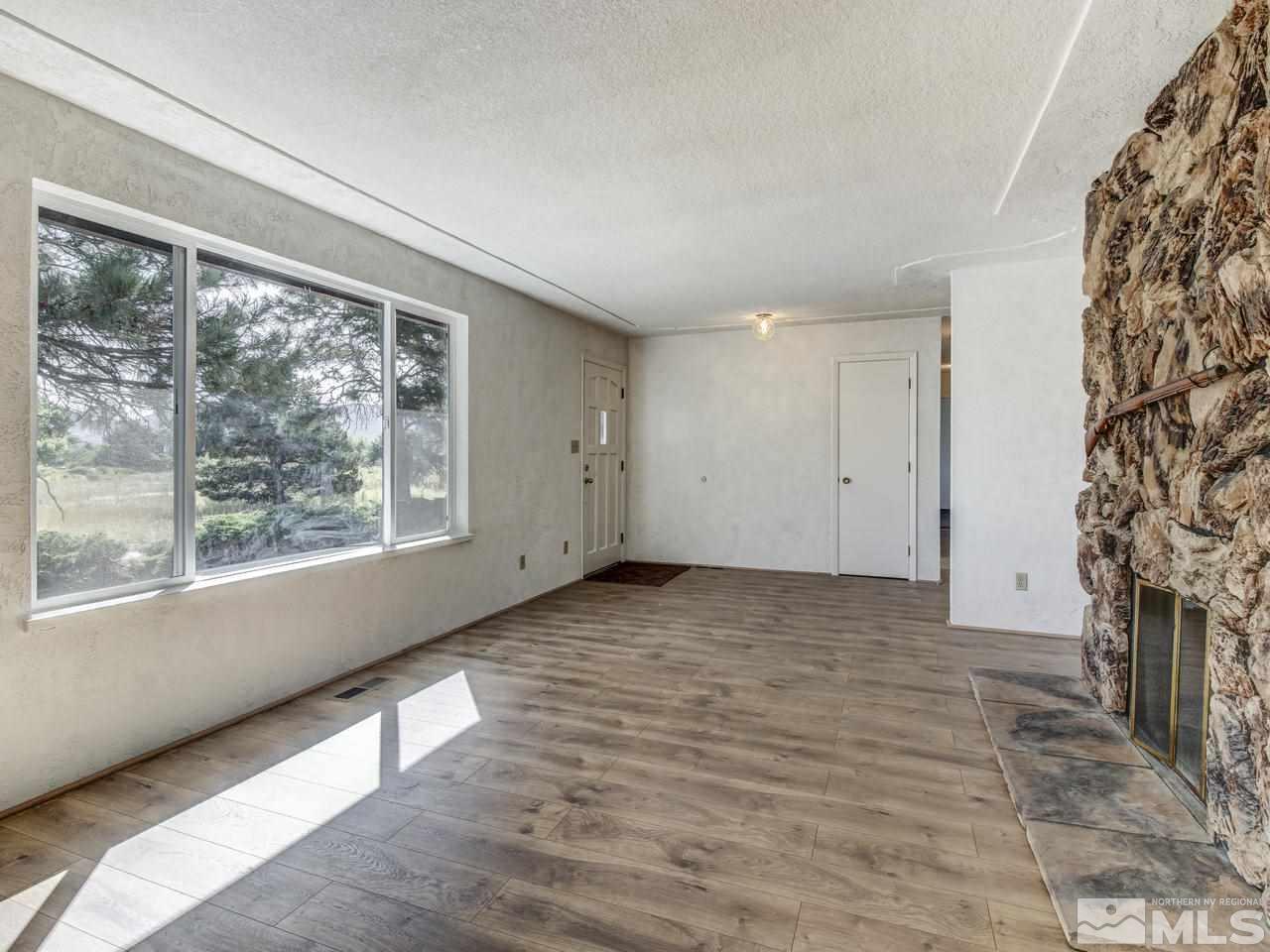 7465 Franktown Road Carson City, NV 89704 - Photo 4 of 25 an empty room with windows