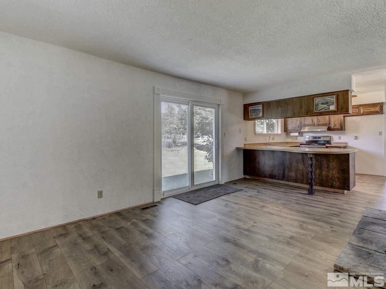 7465 Franktown Road Carson City, NV 89704 - Photo 8 of 25 a view of kitchen with granite countertop window and wooden floor