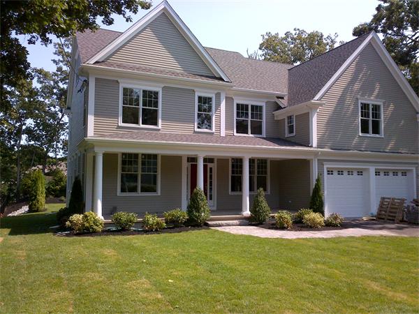 72 Richdale Road Needham, MA 02494 - Photo 1 of 10 a front view of a house with a yard and garage