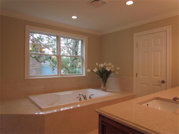 72 Richdale Road Needham, MA 02494 - Photo 8 of 10 a bath tub sitting next to a window