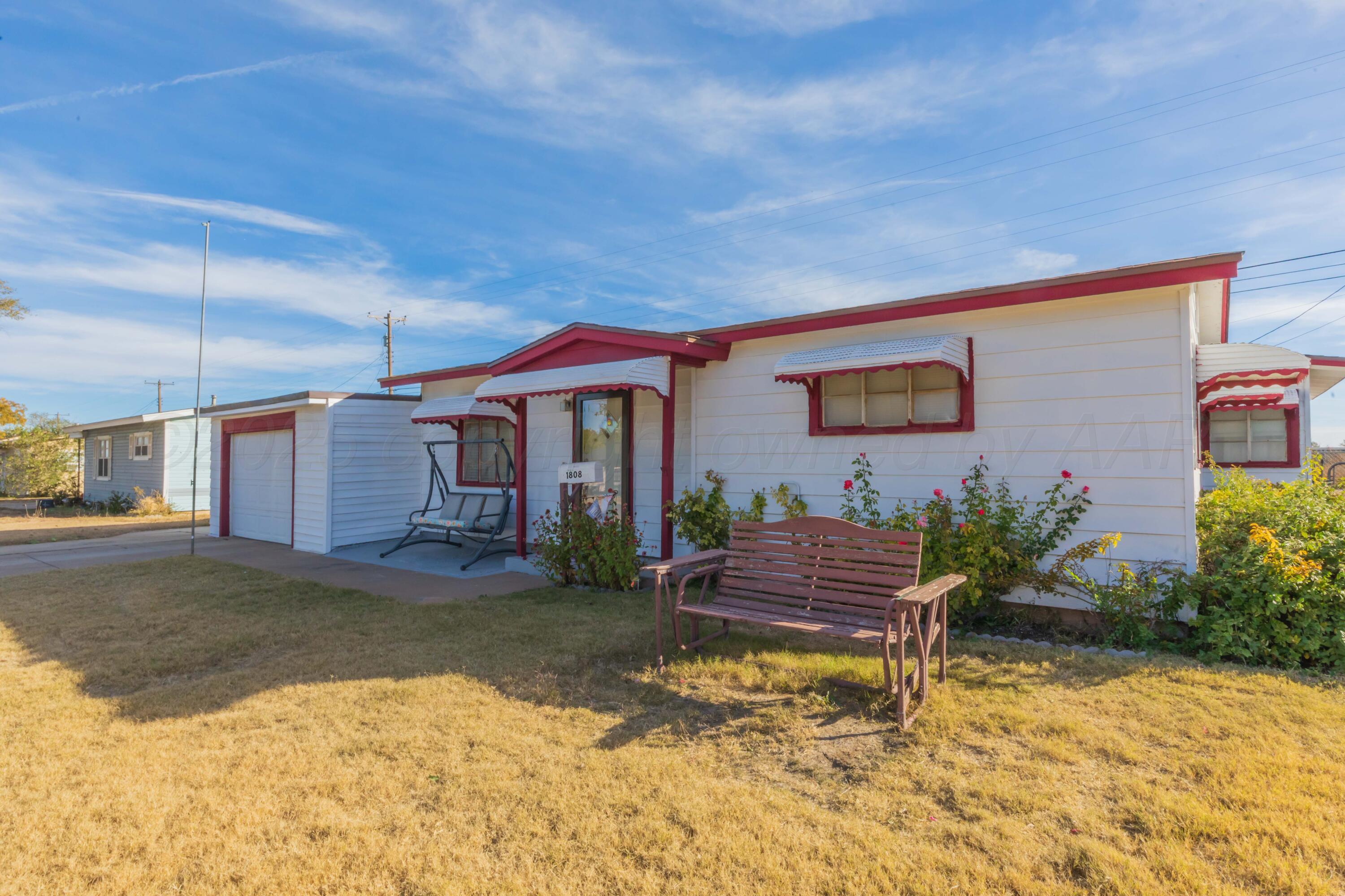 1808 Orange Street Amarillo, TX 79107 - Photo 2 of 38 a front view of a house with garden