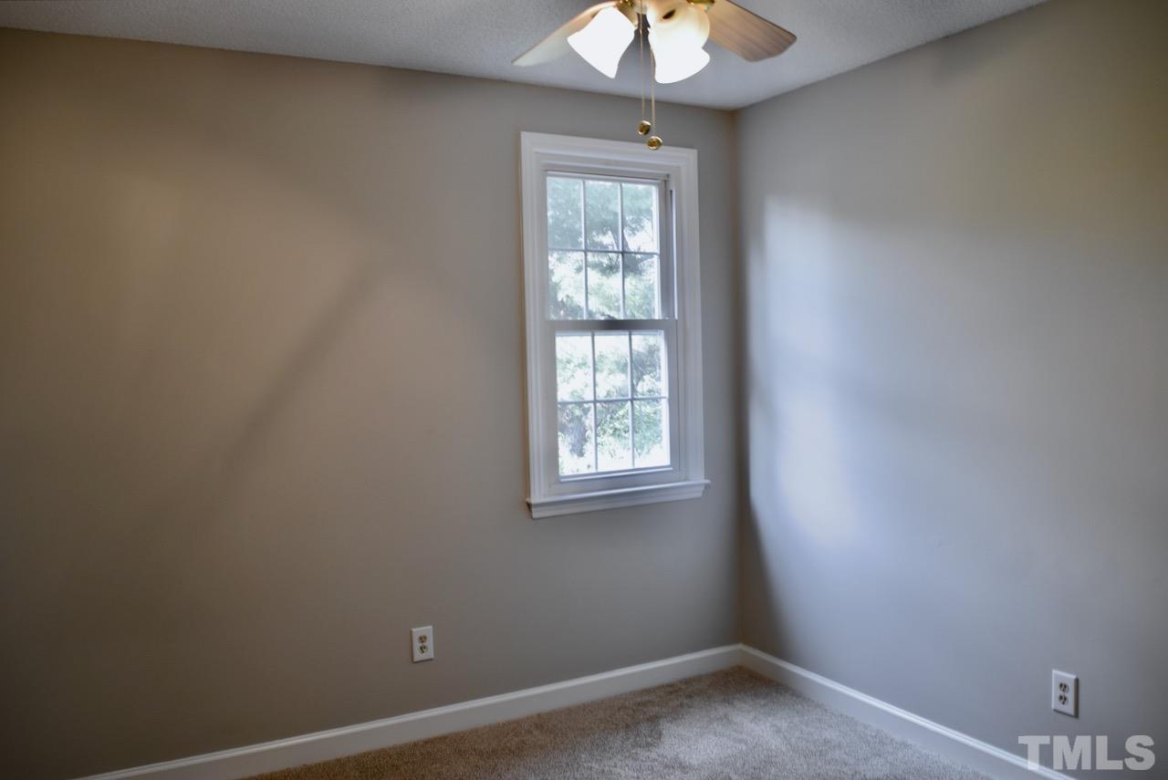 6233 Jones Farm Road Wake Forest, NC 27587 - Photo 14 of 23 Situated on the front of the home, this bedroom has a walk-in closet with window.