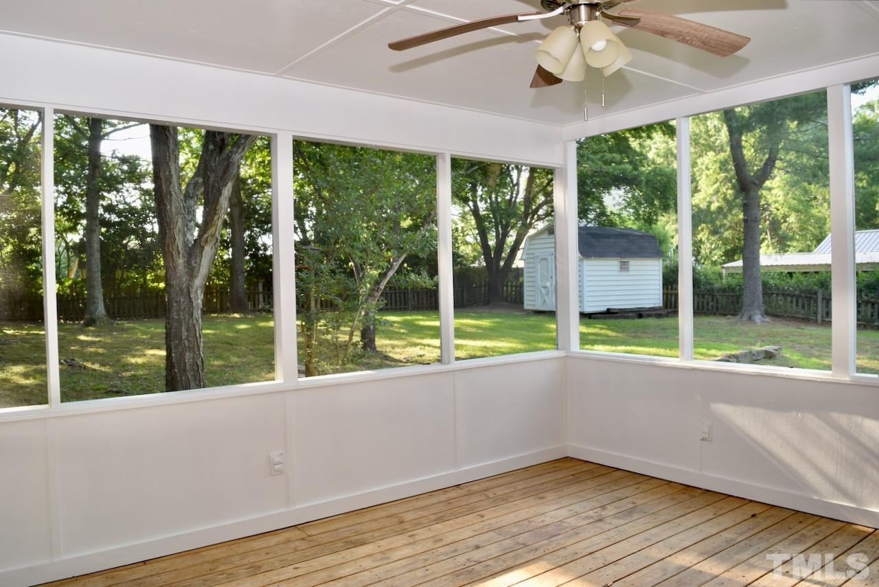 6233 Jones Farm Road Wake Forest, NC 27587 - Photo 19 of 23 You're going to want to put new outdoor furniture out here so you can enjoy the view. There's plenty of room for lots of seating under the ceiling fan and you'll be a few steps from the deck.