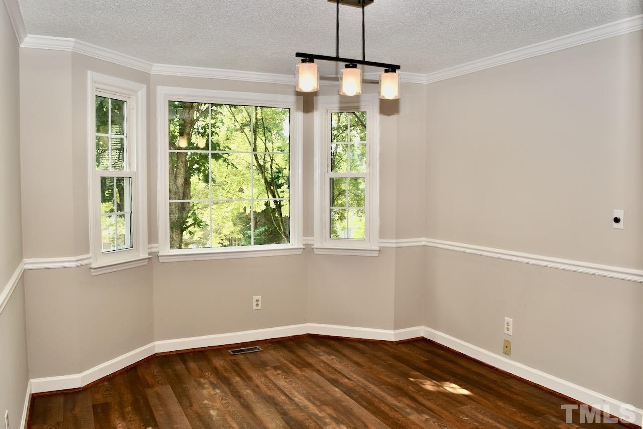 6233 Jones Farm Road Wake Forest, NC 27587 - Photo 8 of 23 Large dining room overlooks the front yard through this large bay window.