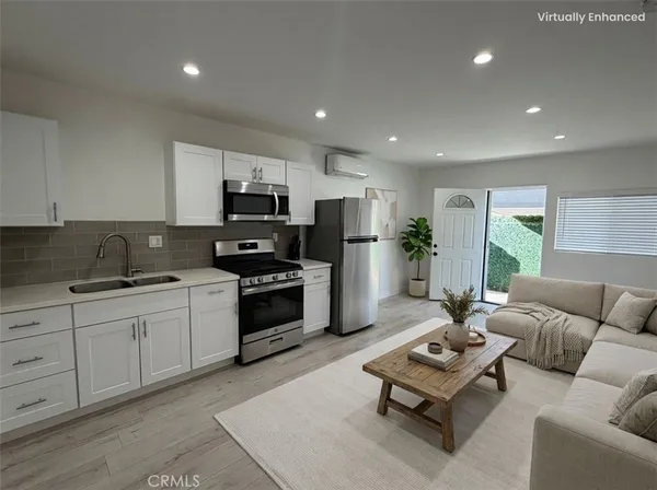 a kitchen with furniture a sink a counter and appliances