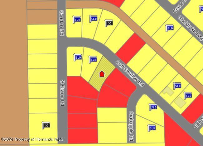 Lot 10 Cliff Swallow Road Weeki Wachee, FL 34614 - Photo 3 of 3 a front view of a building with a yellow lightning