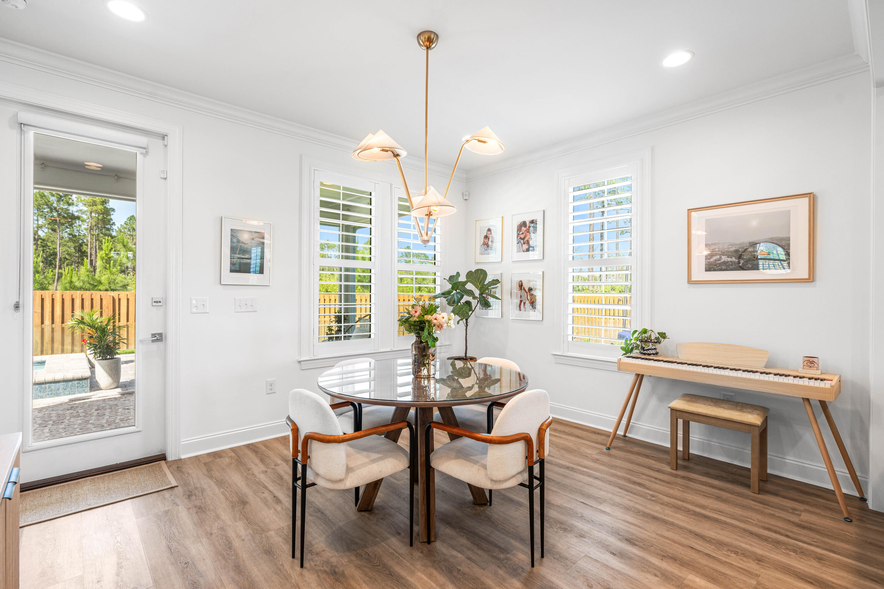 229 Windrow Way Inlet Beach Inlet Beach, FL 32461 - Photo 15 of 66 a dining room with wooden floor and a chandelier