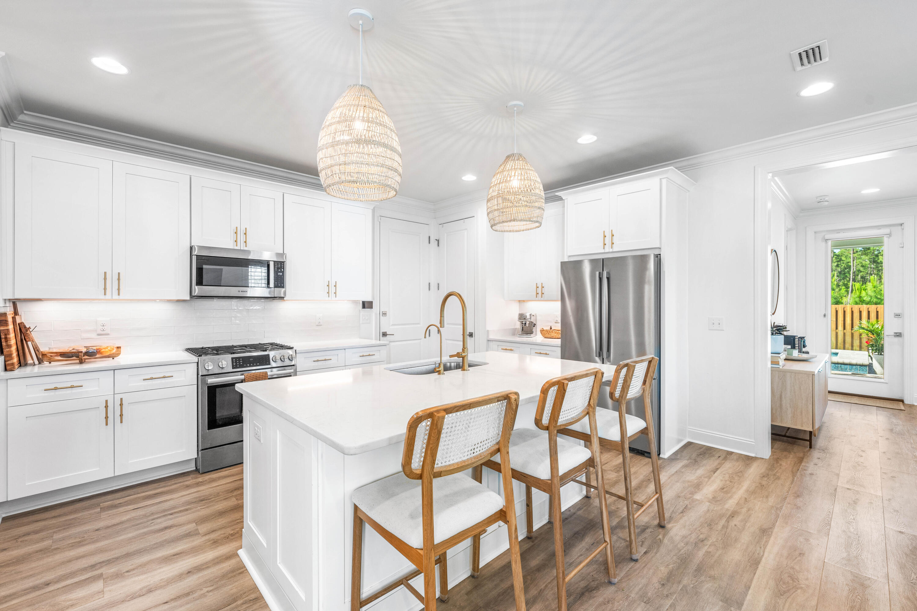 229 Windrow Way Inlet Beach Inlet Beach, FL 32461 - Photo 7 of 66 a kitchen with stainless steel appliances granite countertop a refrigerator oven a sink dishwasher and white cabinets with wooden floor