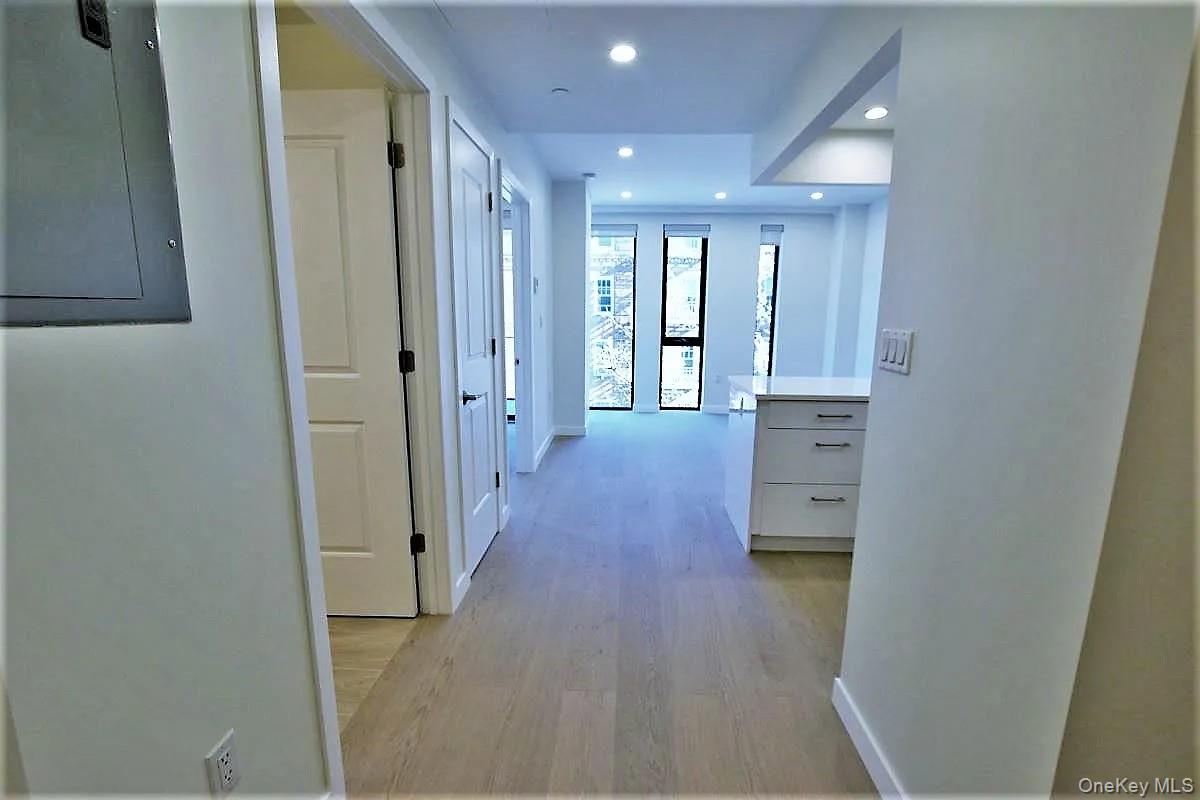 41-26 44th Street, Unit 3C Queens, NY 11104 - Photo 1 of 26 Hall featuring electric panel, light wood-style floors, and recessed lighting