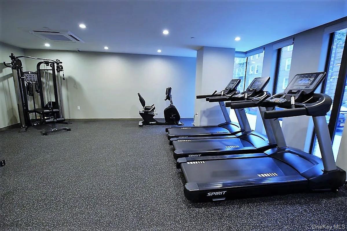 41-26 44th Street, Unit 3C Queens, NY 11104 - Photo 20 of 26 Workout area featuring cooling unit and recessed lighting