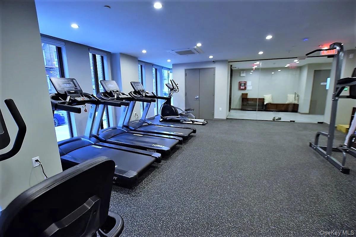 41-26 44th Street, Unit 3C Queens, NY 11104 - Photo 23 of 26 Workout area with recessed lighting and cooling unit