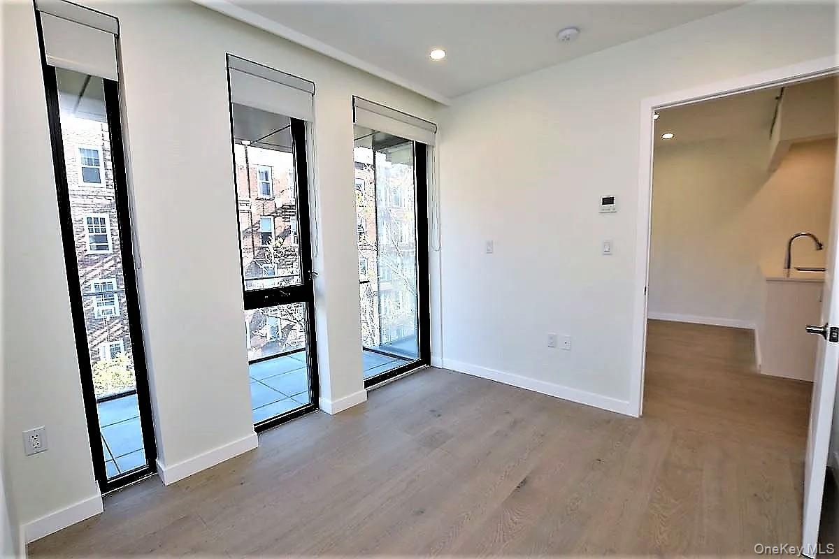 41-26 44th Street, Unit 3C Queens, NY 11104 - Photo 10 of 26 Foyer entrance with plenty of natural light, light wood-style flooring, and recessed lighting