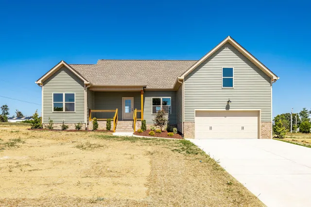 a front view of a house with a outdoor space