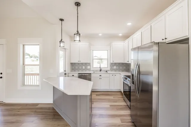 a bedroom with a bed and a mirror