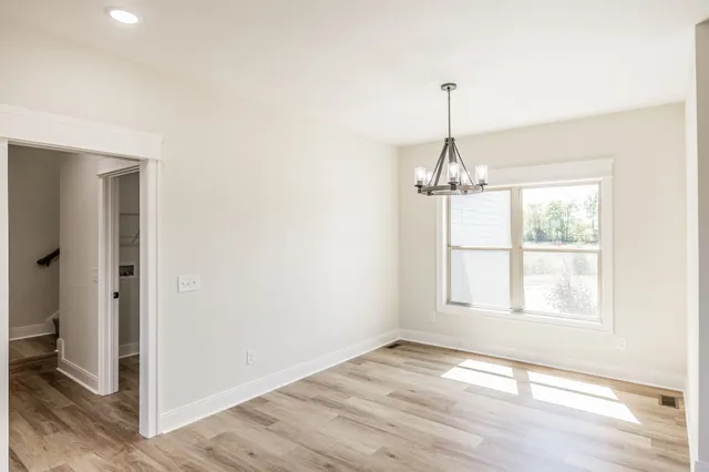 a bathroom with a double vanity sink mirror and shower