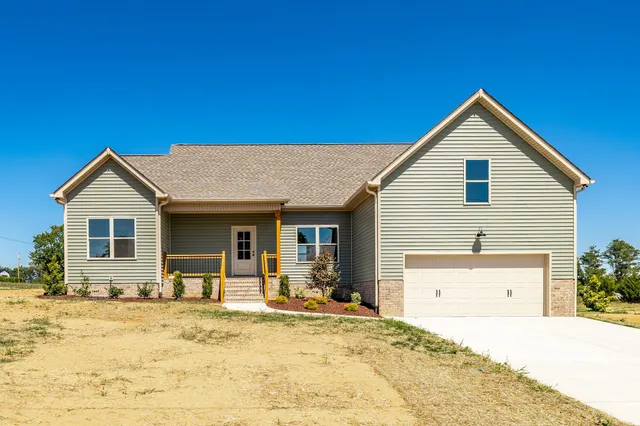 a view of a house with snow on the background