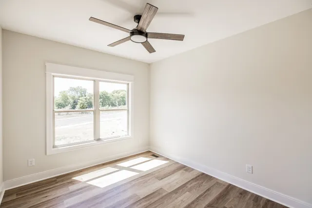 a view of a house with backyard porch and sitting area