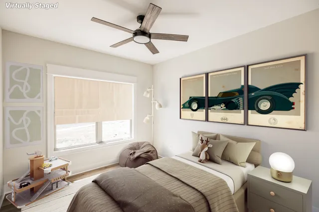 a view of house with small yard and wooden fence