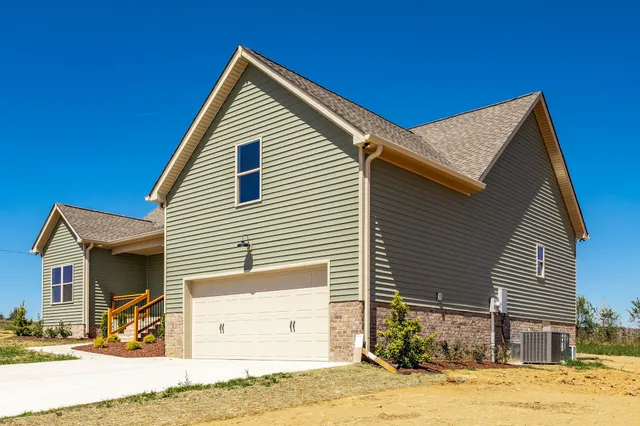a view of a balcony with yard