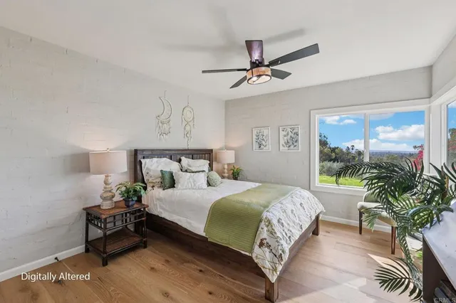 a bedroom with a bed and a table in it