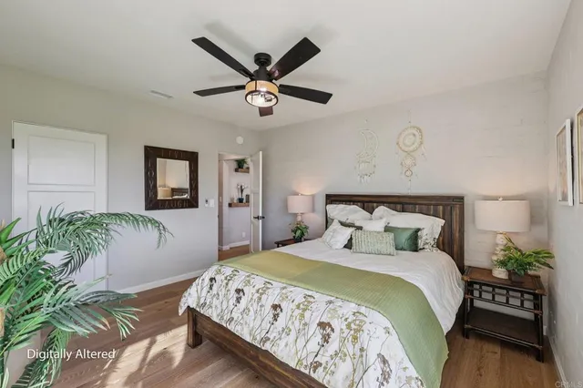 a room with lots of potted plants and wooden floor