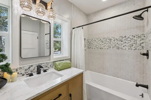 a kitchen with a white sink and cabinets