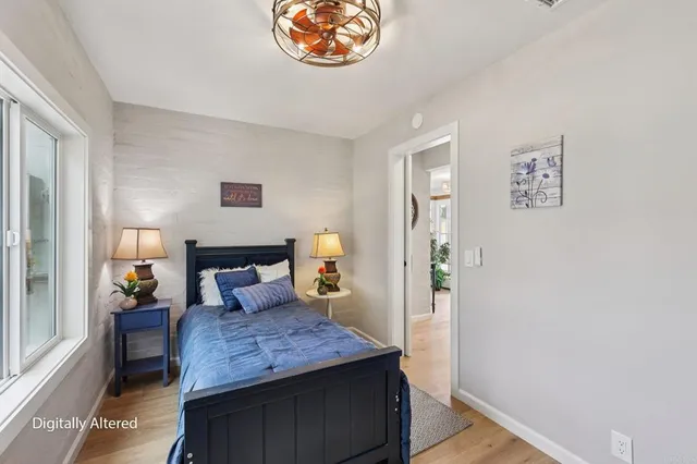 a bathroom with a sink a mirror and a window