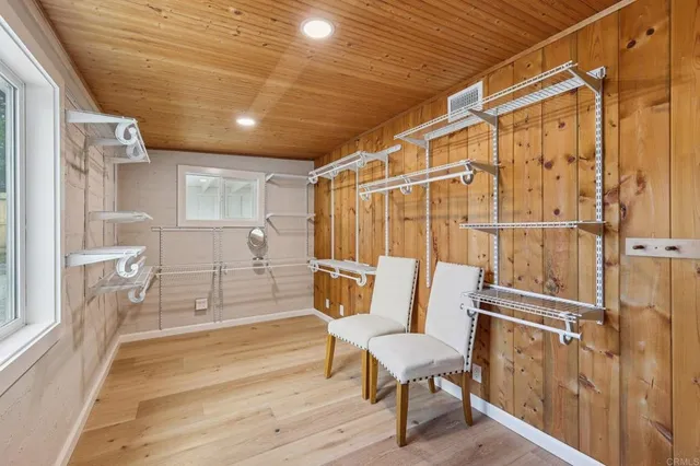 a living room with furniture a dining table and kitchen view