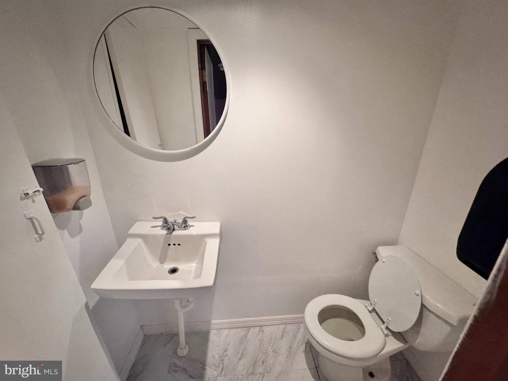 1229 Berkwood Road Baltimore, MD 21237 - Photo 7 of 10 Half bath in the basement