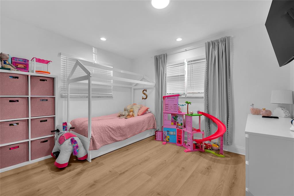 22718 Southwest 65th Terrace Boca Raton, FL 33428 - Photo 13 of 37 a bedroom with bed and a window