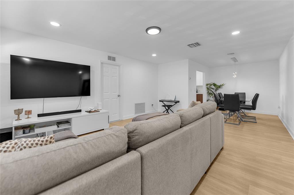 22718 Southwest 65th Terrace Boca Raton, FL 33428 - Photo 23 of 37 a living room with furniture and a flat screen tv