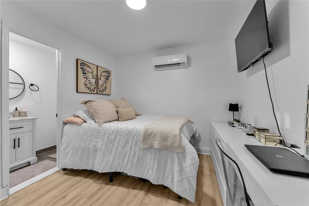 22718 Southwest 65th Terrace Boca Raton, FL 33428 - Photo 25 of 37 a bedroom with a bed and a flat screen tv