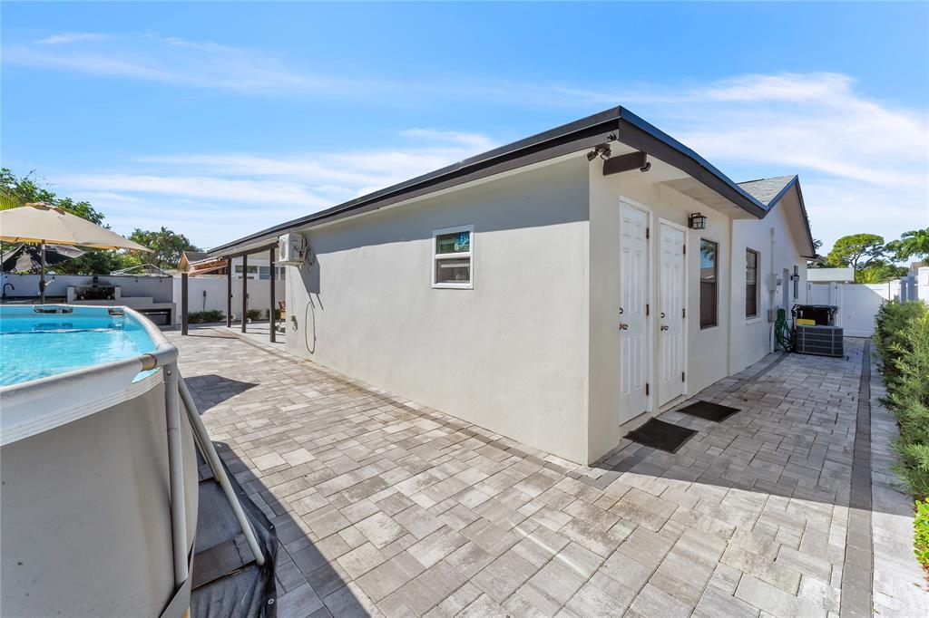 22718 Southwest 65th Terrace Boca Raton, FL 33428 - Photo 27 of 37 a view of house with backyard and trees