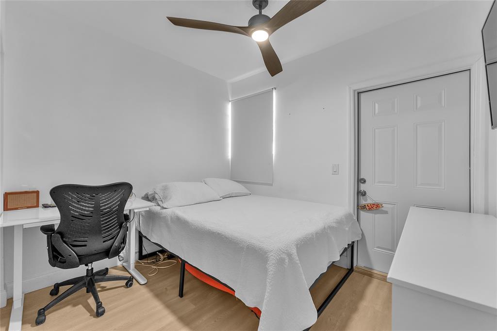 22718 Southwest 65th Terrace Boca Raton, FL 33428 - Photo 28 of 37 a bedroom with a bed and a chair