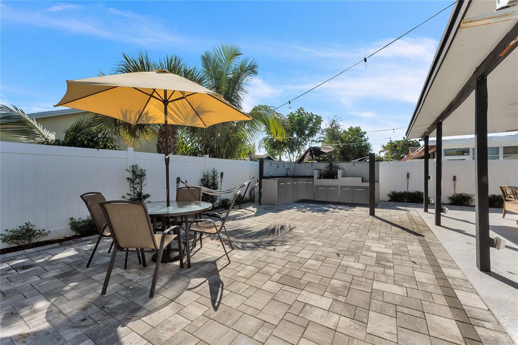 22718 Southwest 65th Terrace Boca Raton, FL 33428 - Photo 29 of 37 a view of a backyard with sitting area