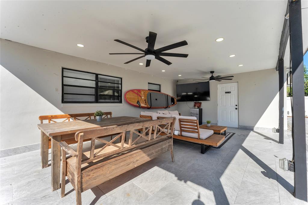 22718 Southwest 65th Terrace Boca Raton, FL 33428 - Photo 3 of 37 a living room with furniture and a chandelier
