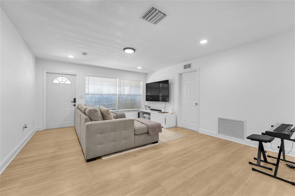 22718 Southwest 65th Terrace Boca Raton, FL 33428 - Photo 7 of 37 a living room with furniture and a flat screen tv