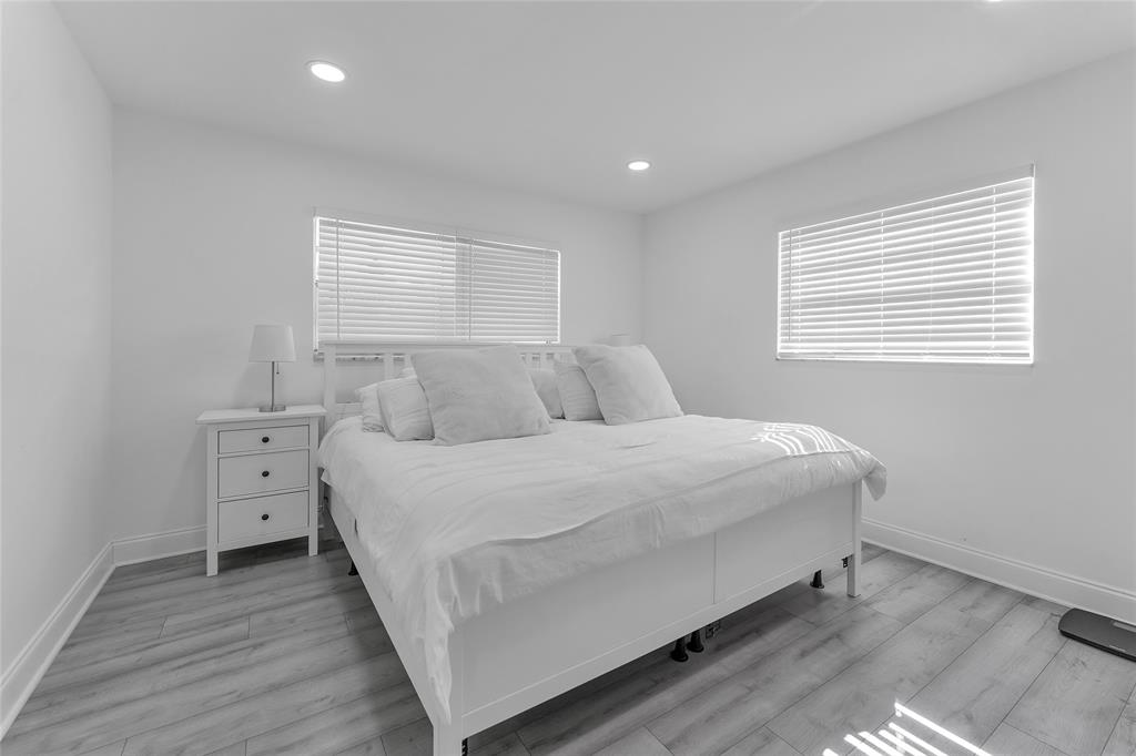 22718 Southwest 65th Terrace Boca Raton, FL 33428 - Photo 8 of 37 a bedroom with a bed and a window