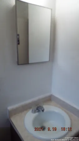 a bathroom with a bathtub and a sink