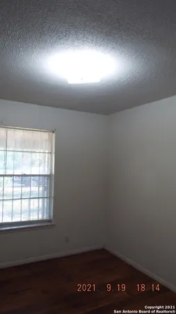 a view of small space with wooden floor