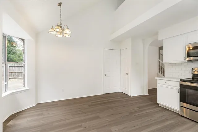 a spacious bathroom with a sink a mirror and a shower