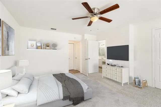 a bathroom with a tub a sink and a mirror