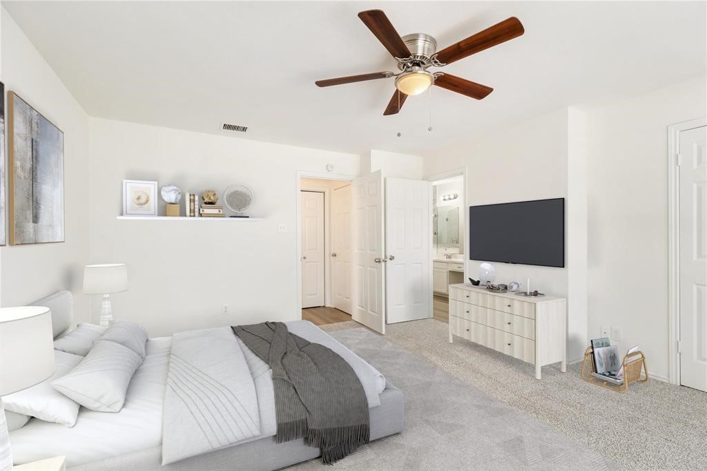 9410 Calwood Circle Spring, TX 77379 - Photo 12 of 34 a bedroom with a bed and a flat screen tv