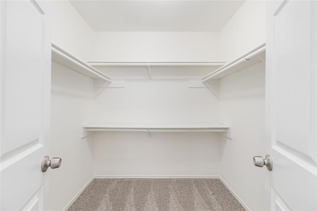 9410 Calwood Circle Spring, TX 77379 - Photo 16 of 34 a view of small space with racks on the wall